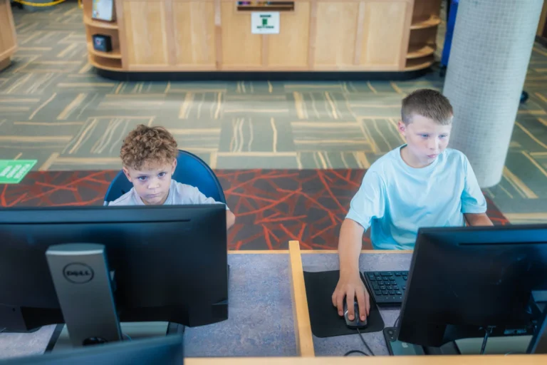 two children using library computers