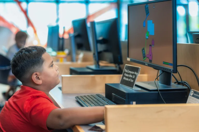 child using library computer